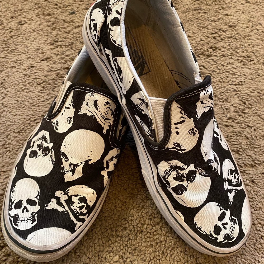 Black and white skull slip on vans